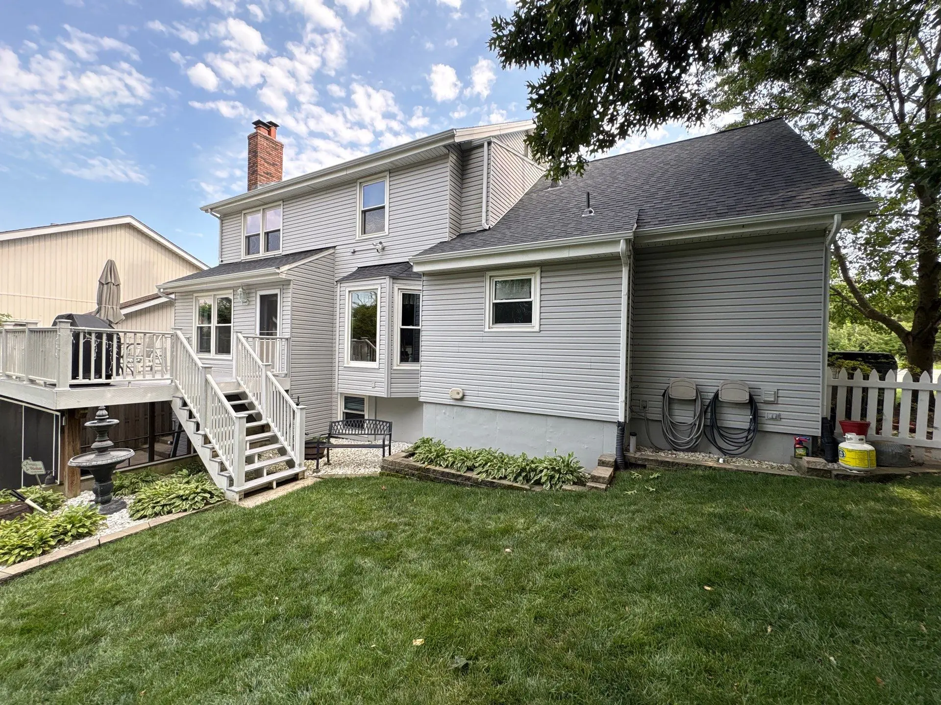 Completed gutters and downspouts on the rear of a home