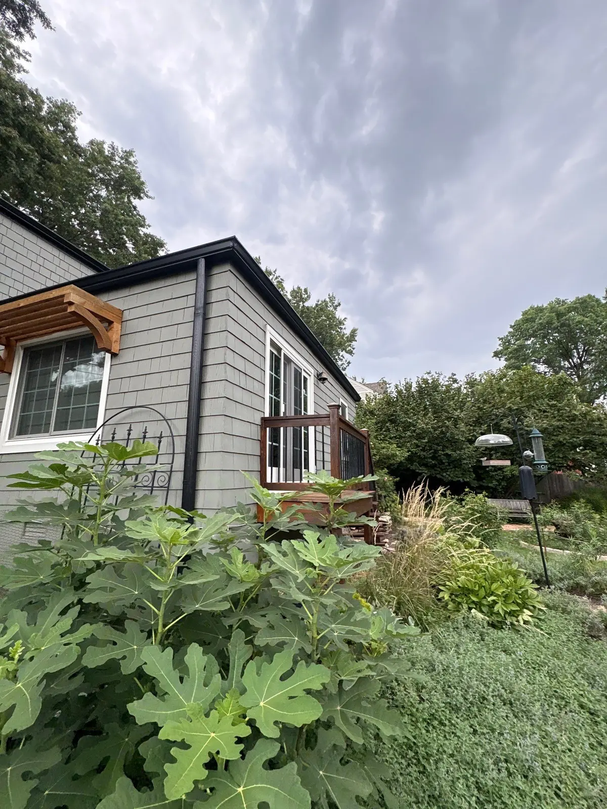 Finished black gutter system along a roofline