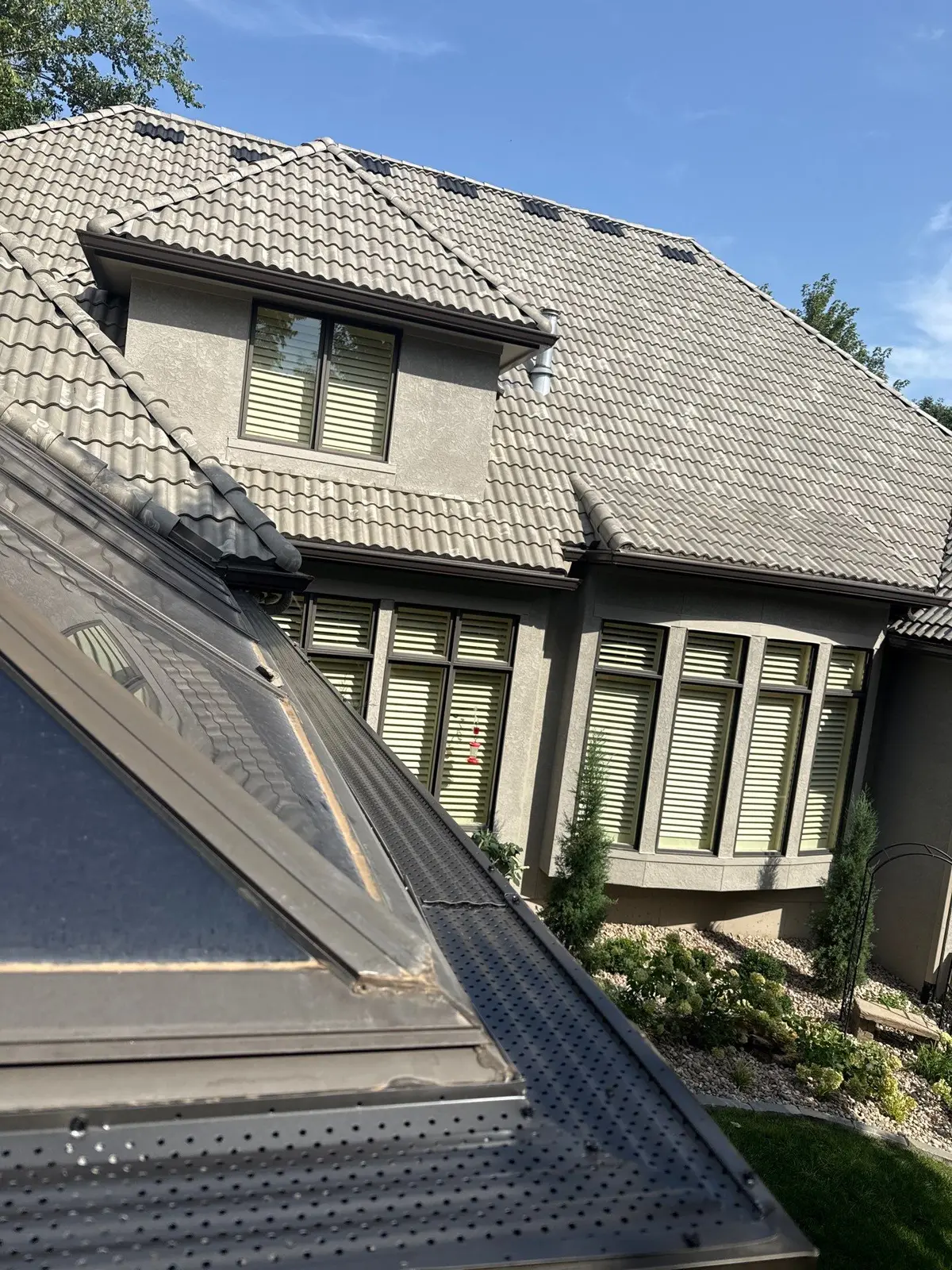 Close view of gutter guards fitted along a roof edge