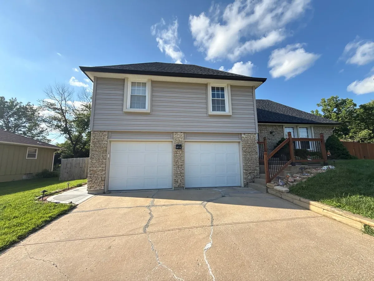 6-inch seamless gutters over a two-car garage in Parkville, MO