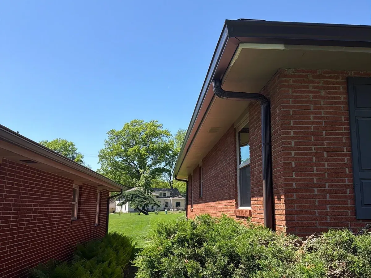 6-inch seamless gutters with LeafBlaster Pro guards on a brick ranch in Roeland Park, KS