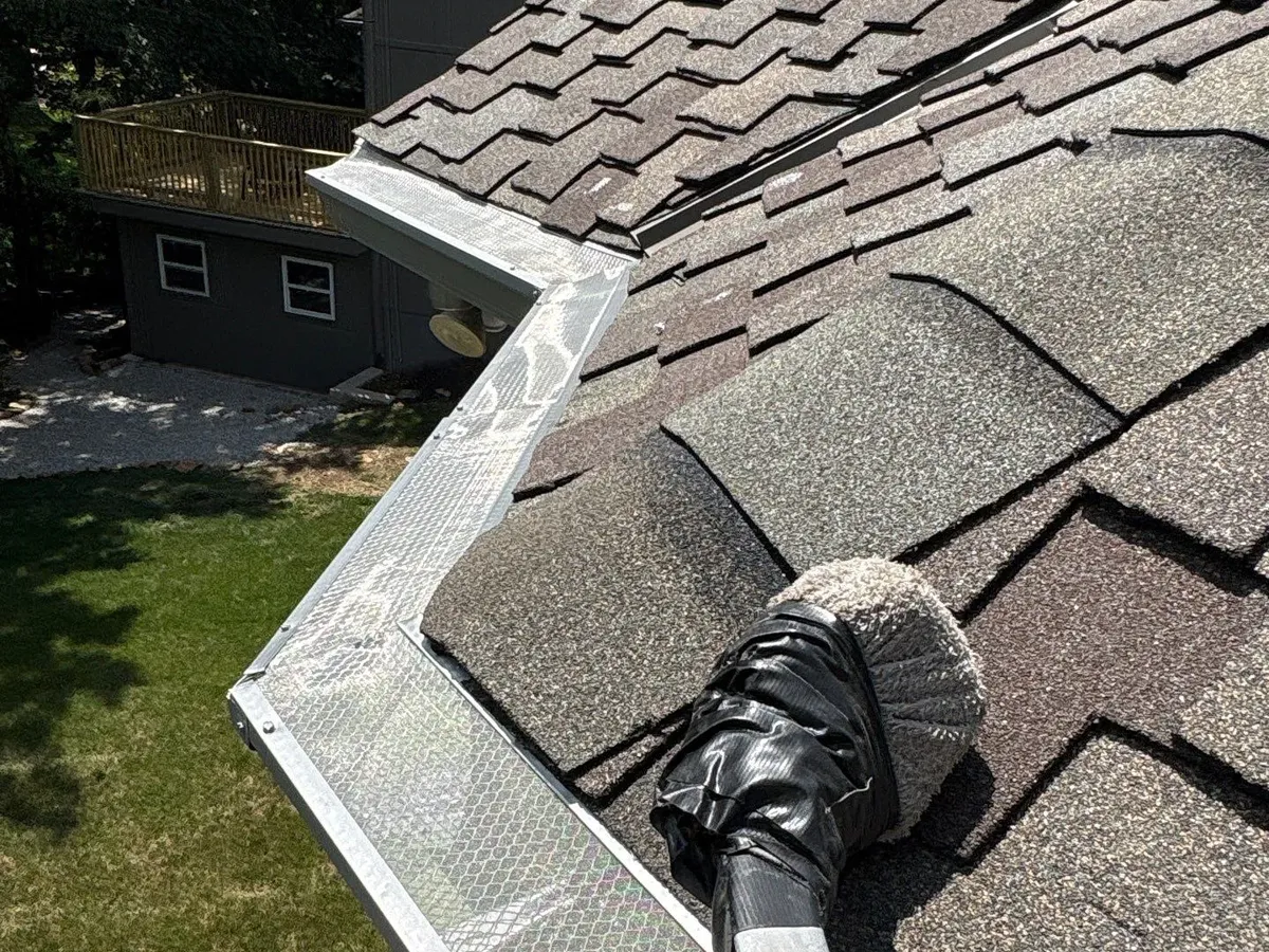 Gutter guards fitted at a roof valley in Parkville, MO
